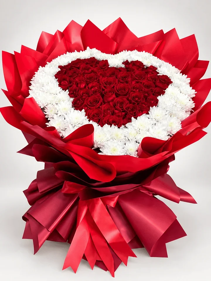 Evermore: A heart of red roses framed by white flowers, finished in rich red wrapping.